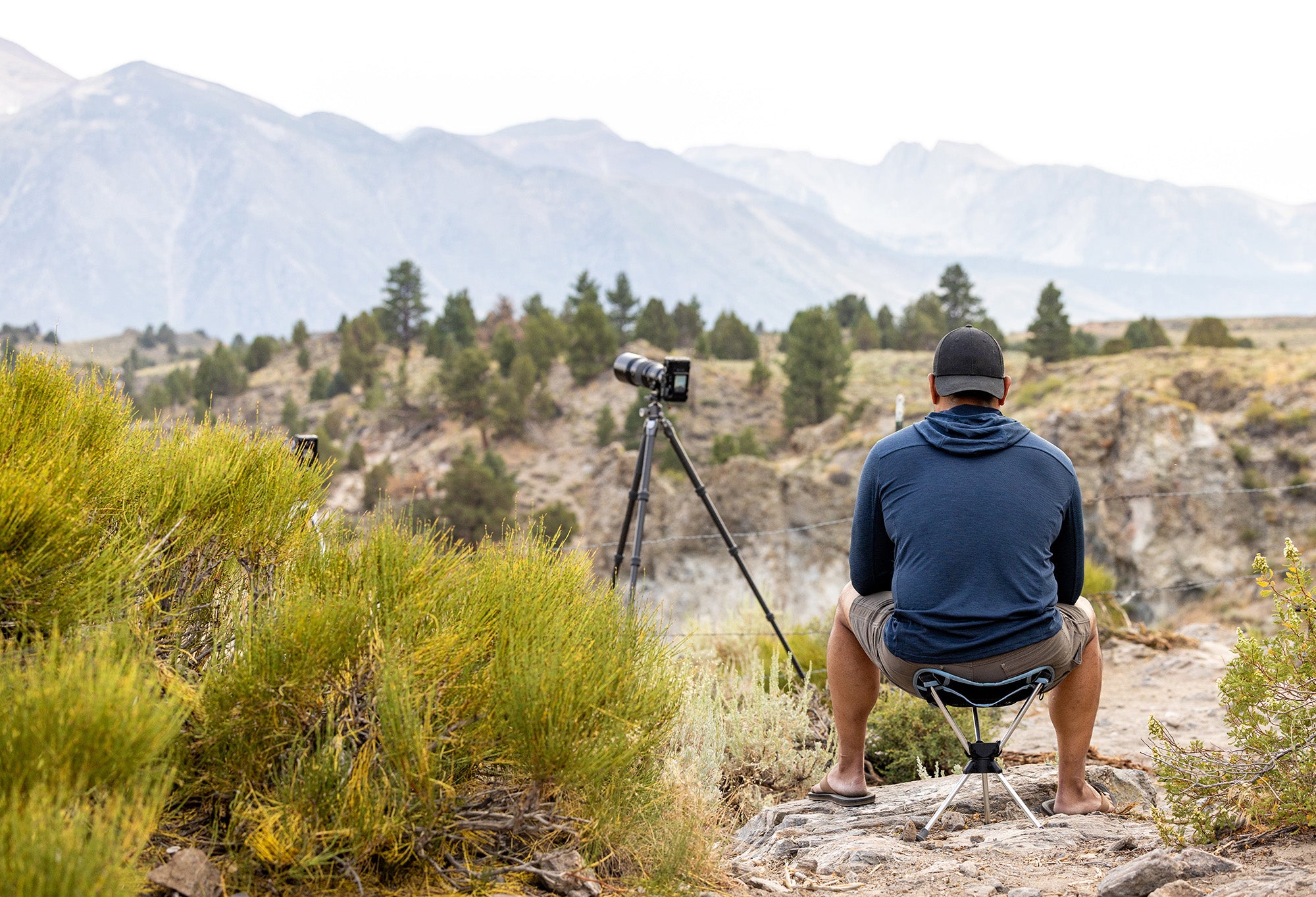 landscape photographer using compass 360 stool