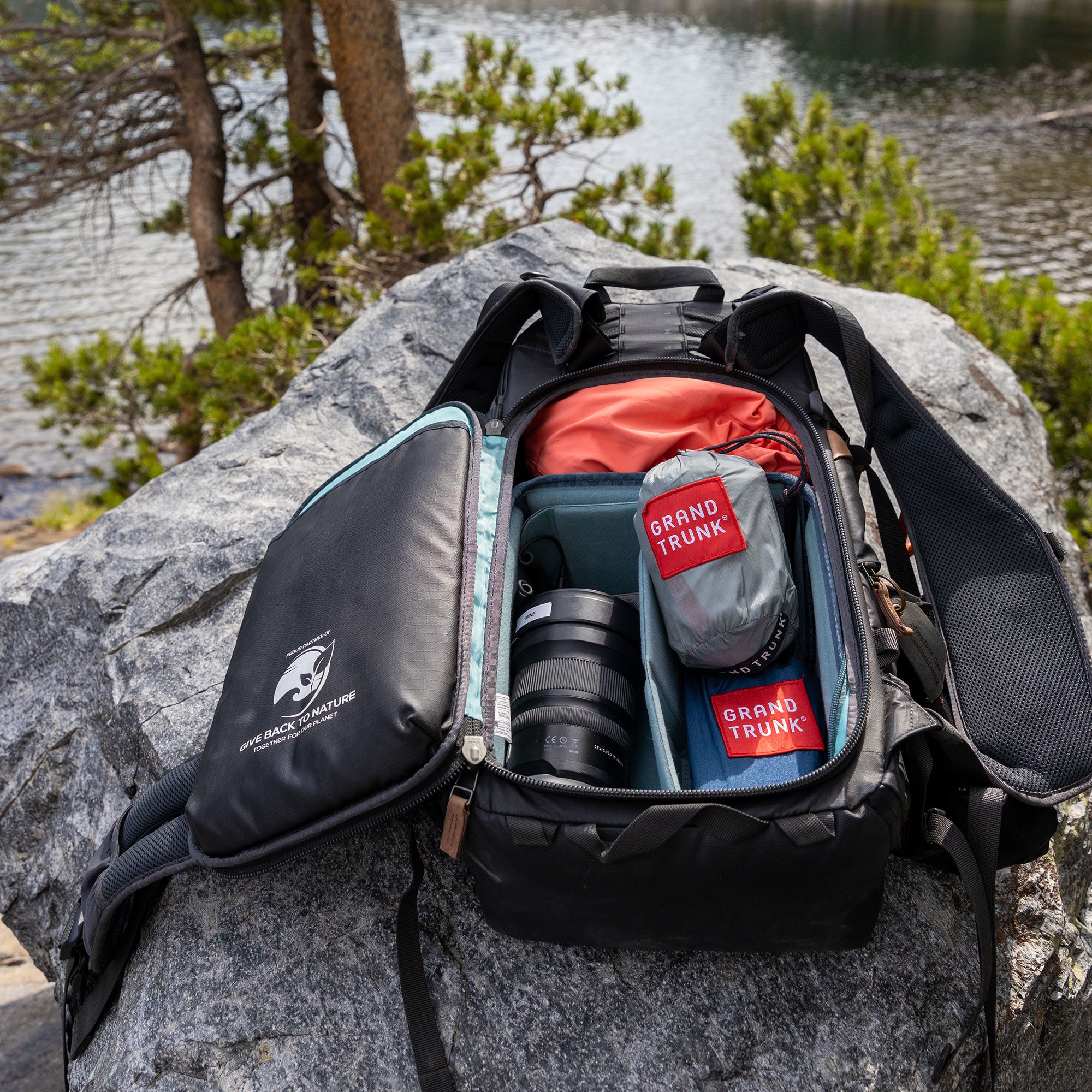 Nano 7 Hammock in camera bag on a rock in the woods